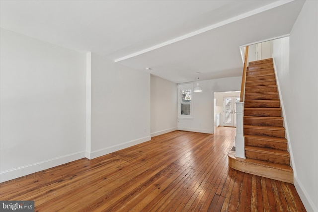 439 Mercy St, Philadelphia, PA 19148 - unfurnished living room with stairway, wood-type flooring, and baseboards
