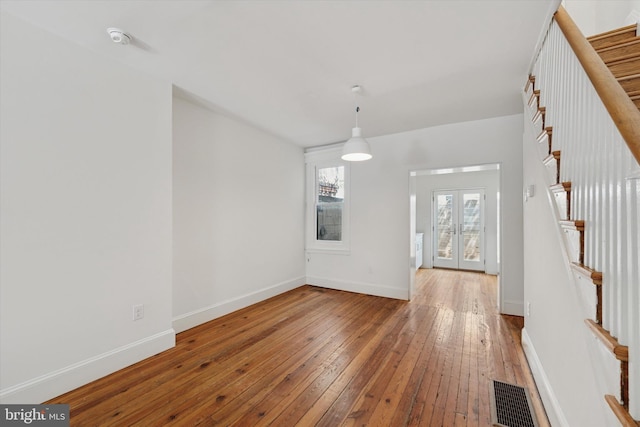 439 Mercy St, Philadelphia, PA 19148 - unfurnished dining area featuring stairs, hardwood / wood-style flooring, and baseboards