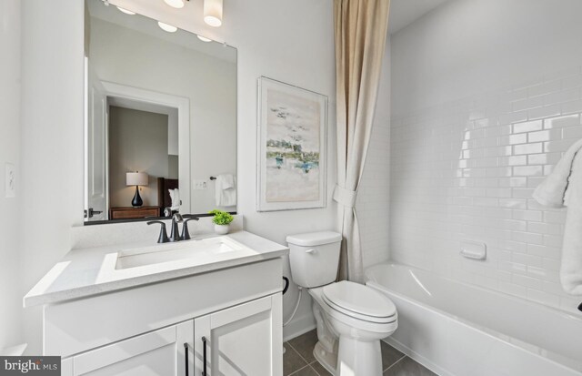 1203 Bear Oak Ln, Laurel, MD 20724 - bathroom featuring vanity, shower / tub combo, toilet, tile patterned flooring, and baseboards