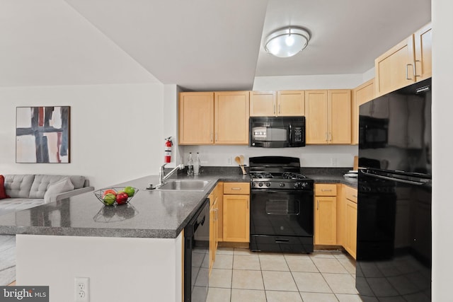 800 4th St SW Unit N216, Washington, DC 20024 - kitchen with black appliances, a sink, light brown cabinets, light tile patterned floors, and a peninsula