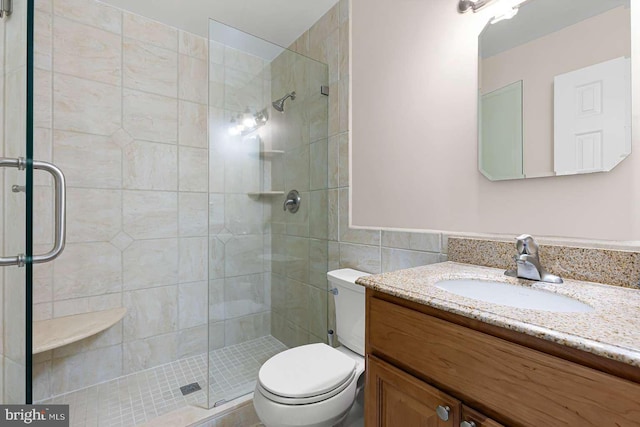 536 Dawson Trak, Hockessin, DE 19707 - bathroom with vanity, a stall shower, toilet, and tile walls