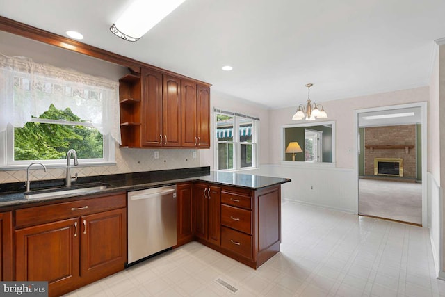 536 Dawson Trak, Hockessin, DE 19707 - kitchen with stainless steel dishwasher, a sink, a chandelier, a peninsula, and plenty of natural light