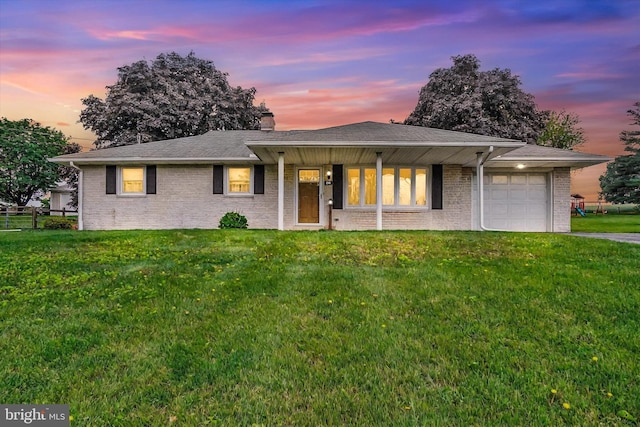144 Ridgeview Rd, Seven Valleys, PA 17360 - ranch-style house featuring an attached garage, brick siding, a chimney, driveway, and roof with shingles