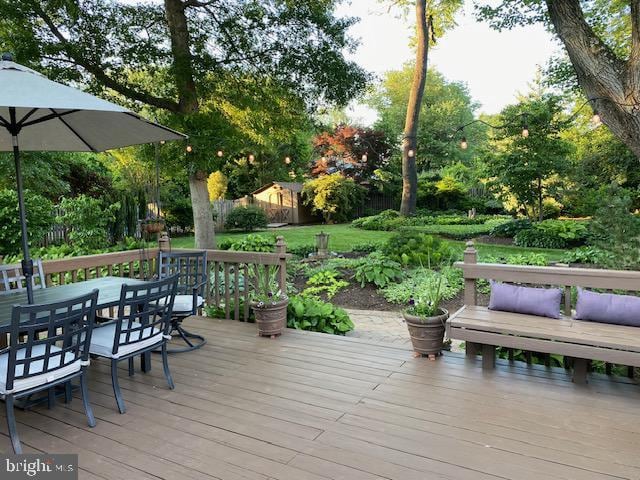 207 Ceret Ct SW, Vienna, VA 22180 - deck with outdoor dining space and view of wooded area