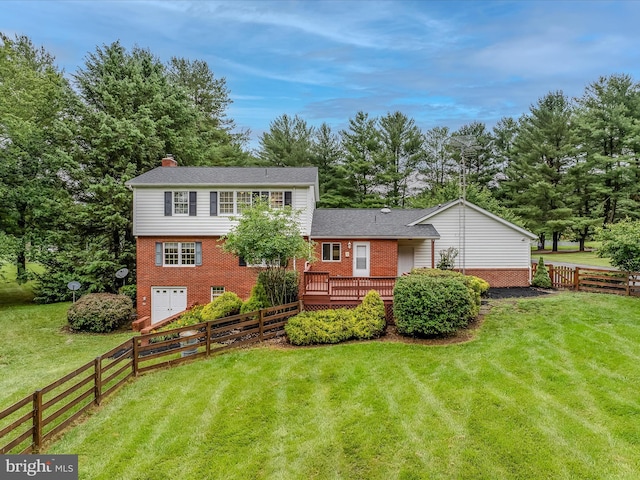 182 Humphrey Ln, Falling Waters, WV 25419 - rear view of house featuring brick siding, a deck, a chimney, and a fenced backyard