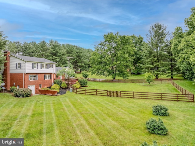 182 Humphrey Ln, Falling Waters, WV 25419 - view of yard with an attached garage