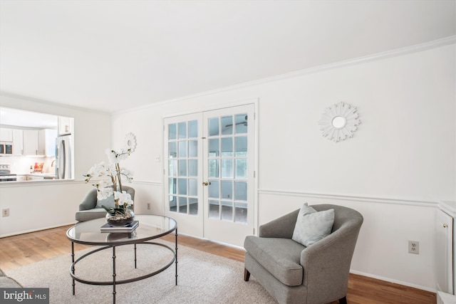 944 War Admiral St, Great Falls, VA 22066 - living area featuring french doors, wood finished floors, and crown molding