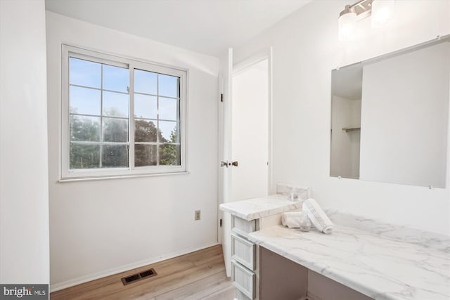 944 War Admiral St, Great Falls, VA 22066 - bathroom with wood finished floors, baseboards, and vanity