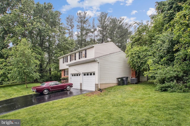944 War Admiral St, Great Falls, VA 22066 - view of side of property featuring driveway, an attached garage, a lawn, central air condition unit, and view of scattered trees