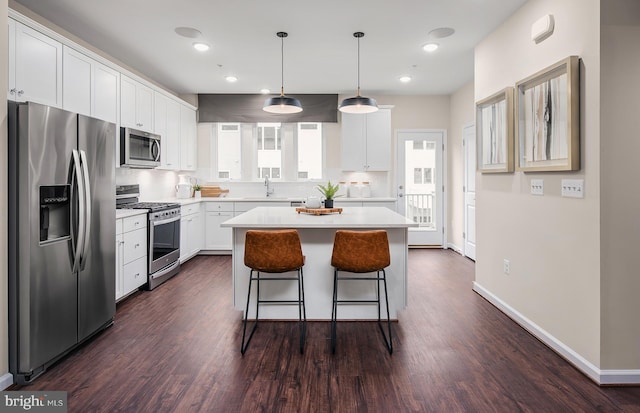 1205 Bear Oak Ln, Laurel, MD 20724 - kitchen featuring stainless steel appliances, a sink, white cabinetry, dark wood finished floors, and recessed lighting