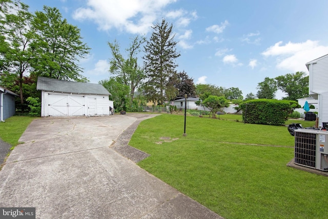 1833 W High St, Haddon Heights, NJ 08035 - view of green lawn with a detached garage, an outbuilding, and cooling unit