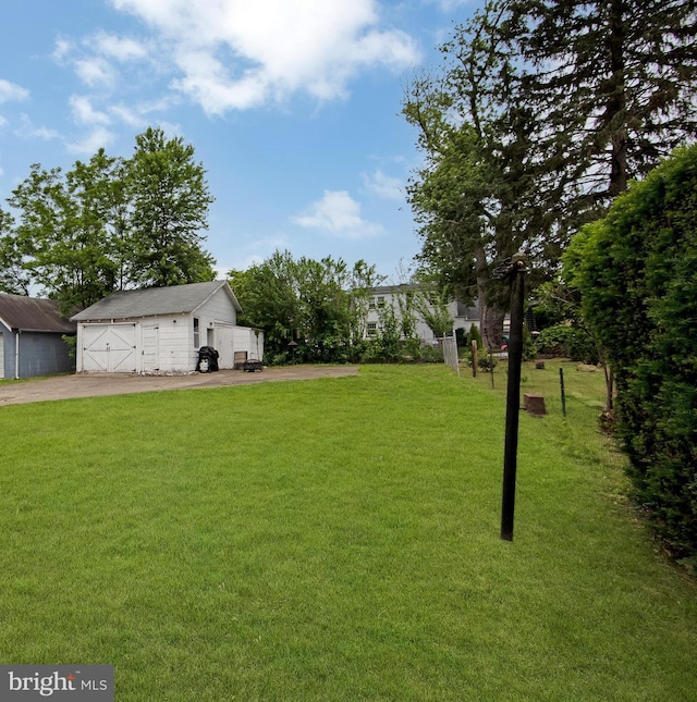 1833 W High St, Haddon Heights, NJ 08035 - view of green lawn featuring an outbuilding and a garage