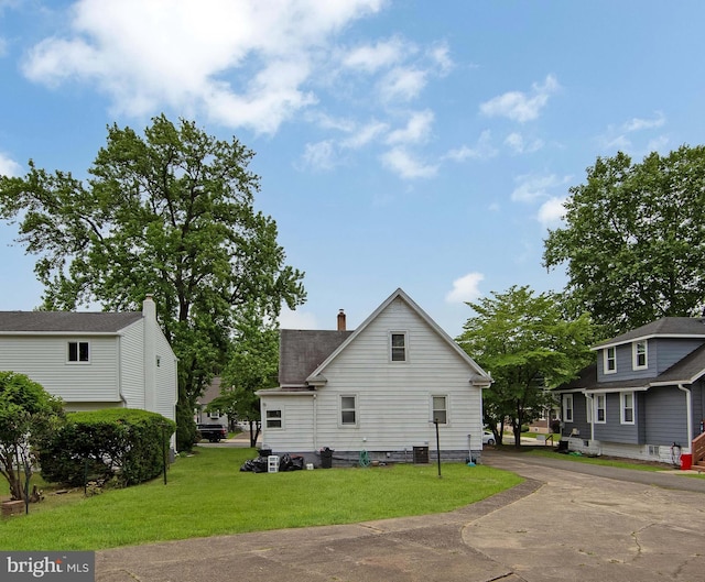 1833 W High St, Haddon Heights, NJ 08035 - back of house featuring a yard, a chimney, and cooling unit
