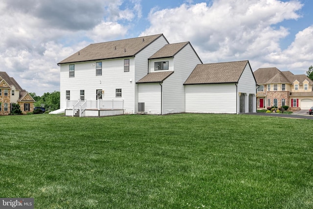 1201 Falls Grove Ln, York, PA 17404 - rear view of property featuring a lawn, an attached garage, a shingled roof, and central air condition unit