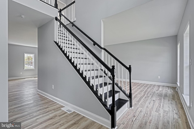 1201 Falls Grove Ln, York, PA 17404 - stairway featuring wood finished floors and baseboards