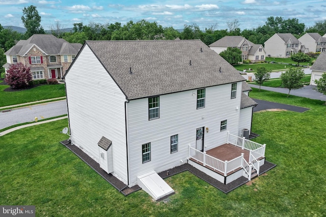 1201 Falls Grove Ln, York, PA 17404 - rear view of house featuring a deck, a lawn, a shingled roof, and a residential view