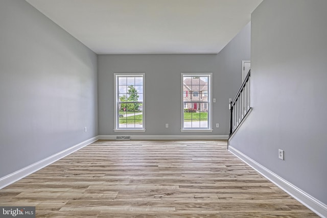 1201 Falls Grove Ln, York, PA 17404 - spare room with wood finished floors, baseboards, and stairs