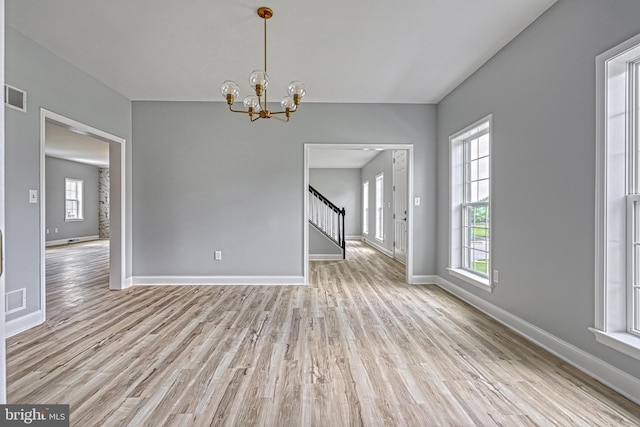 1201 Falls Grove Ln, York, PA 17404 - unfurnished dining area with healthy amount of natural light, light wood-style floors, and baseboards