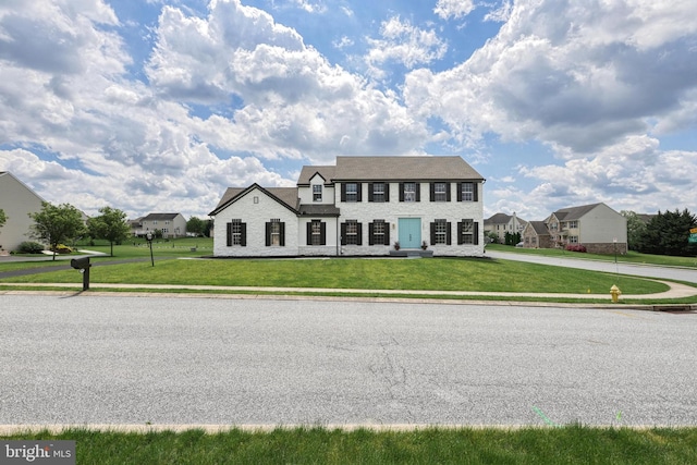 1201 Falls Grove Ln, York, PA 17404 - view of front facade with a front lawn and stone siding