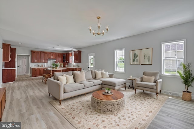 1201 Falls Grove Ln, York, PA 17404 - living room with a chandelier, plenty of natural light, light wood-style flooring, and recessed lighting