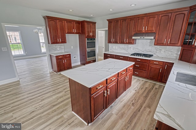 1201 Falls Grove Ln, York, PA 17404 - kitchen featuring stainless steel appliances, under cabinet range hood, light wood finished floors, reddish brown cabinets, and recessed lighting