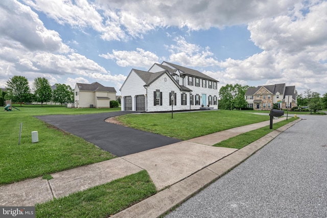 1201 Falls Grove Ln, York, PA 17404 - view of front of property featuring a garage, a front yard, driveway, and brick siding