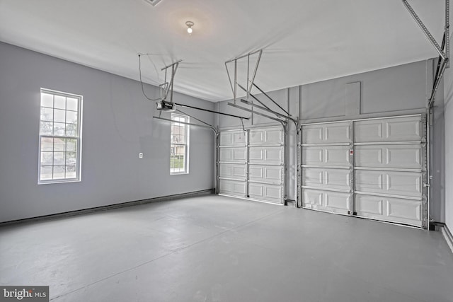 1201 Falls Grove Ln, York, PA 17404 - garage featuring a garage door opener and baseboards