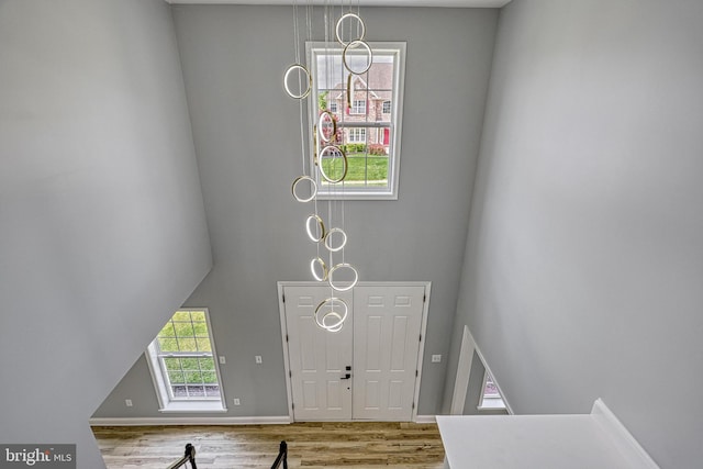 1201 Falls Grove Ln, York, PA 17404 - foyer entrance with wood finished floors, a towering ceiling, and baseboards