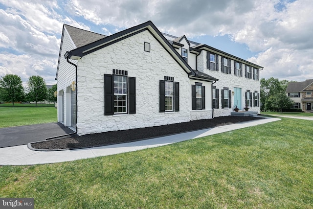 1201 Falls Grove Ln, York, PA 17404 - view of front of house with stone siding, a front lawn, and a garage