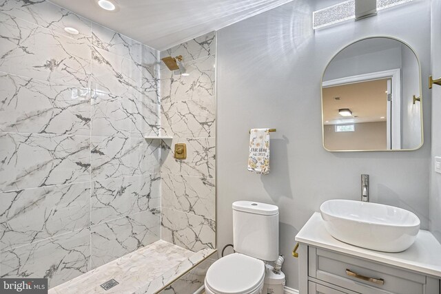 1201 Falls Grove Ln, York, PA 17404 - full bath with tiled shower, vanity, toilet, marble finish flooring, and baseboards