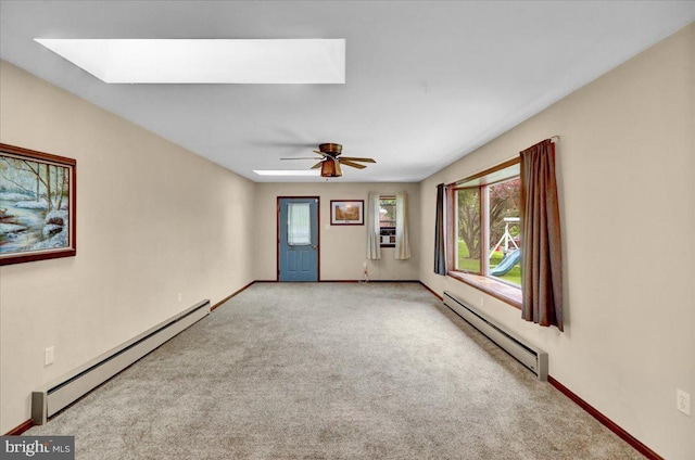 64 W Fairview St, Mohnton, PA 19540 - carpeted spare room featuring a skylight, a baseboard radiator, baseboard heating, a ceiling fan, and baseboards