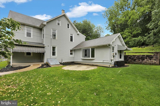 64 W Fairview St, Mohnton, PA 19540 - rear view of property with a yard, cooling unit, and a chimney