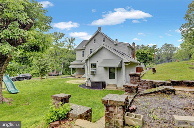 64 W Fairview St, Mohnton, PA 19540 - back of property featuring a lawn, a chimney, and central AC