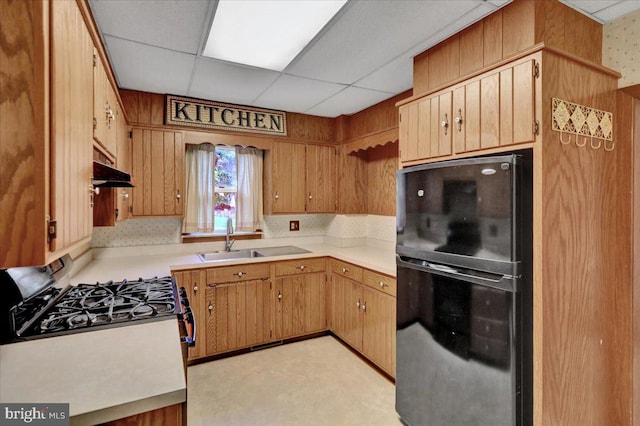 64 W Fairview St, Mohnton, PA 19540 - kitchen featuring freestanding refrigerator, a sink, stainless steel range with gas stovetop, under cabinet range hood, and light countertops