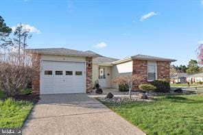 31 Carter Way, Brick, NJ 08723 - ranch-style home with an attached garage, driveway, and a front lawn