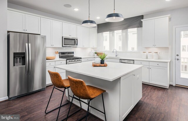 1205 Bear Oak Ln Unit 2, Laurel, MD 20724 - kitchen featuring appliances with stainless steel finishes, recessed lighting, backsplash, white cabinets, and a center island