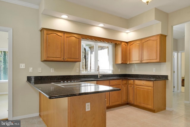 614 Cedarday Dr, Bel Air, MD 21015 - kitchen featuring a sink, a peninsula, black electric stovetop, dark stone countertops, and plenty of natural light