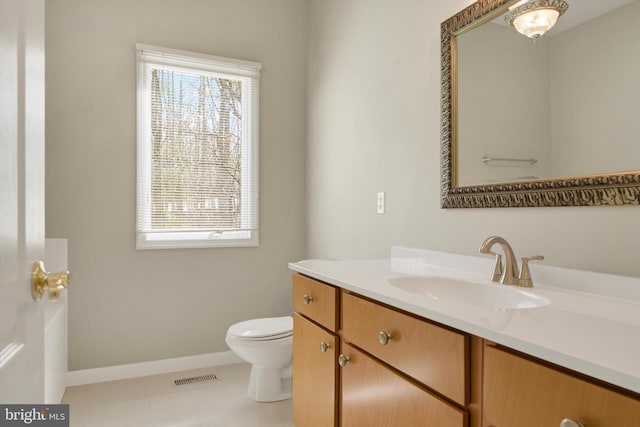 614 Cedarday Dr, Bel Air, MD 21015 - bathroom with toilet, vanity, plenty of natural light, and baseboards