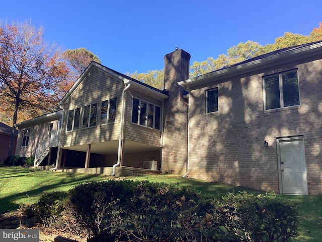 614 Cedarday Dr, Bel Air, MD 21015 - view of property exterior with a chimney, stairs, brick siding, and a yard