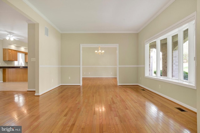 614 Cedarday Dr, Bel Air, MD 21015 - empty room with a chandelier, light wood-style floors, crown molding, baseboards, and ceiling fan