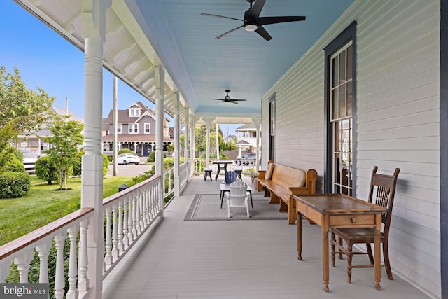 123 Coral St, Beach Haven, NJ 08008 - porch with ceiling fan, a yard, and a residential view