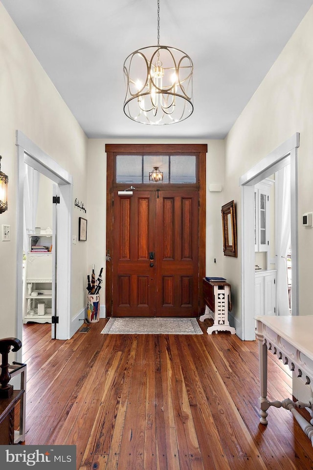 123 Coral St, Beach Haven, NJ 08008 - entryway with hardwood / wood-style floors, a chandelier, and baseboards