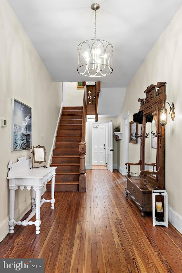 123 Coral St, Beach Haven, NJ 08008 - foyer entrance featuring wood-type flooring, stairs, a chandelier, baseboards, and vaulted ceiling