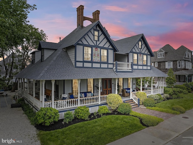 123 Coral St, Beach Haven, NJ 08008 - view of front of home featuring a porch, a shingled roof, a yard, and a chimney