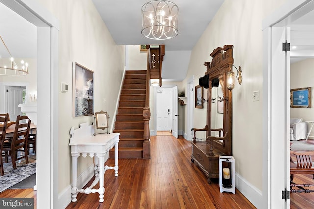 123 Coral St, Beach Haven, NJ 08008 - foyer with a chandelier, wood-type flooring, stairway, and baseboards