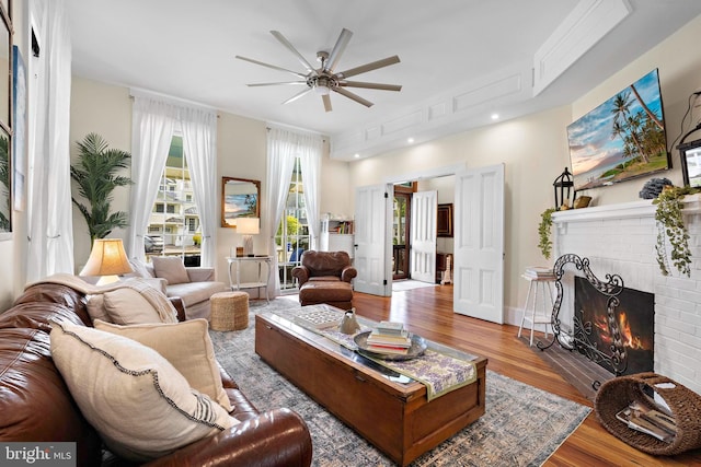 123 Coral St, Beach Haven, NJ 08008 - living area featuring ceiling fan, wood finished floors, and a brick fireplace
