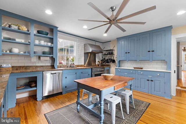 123 Coral St, Beach Haven, NJ 08008 - kitchen with stainless steel appliances, blue cabinetry, ventilation hood, open shelves, and recessed lighting