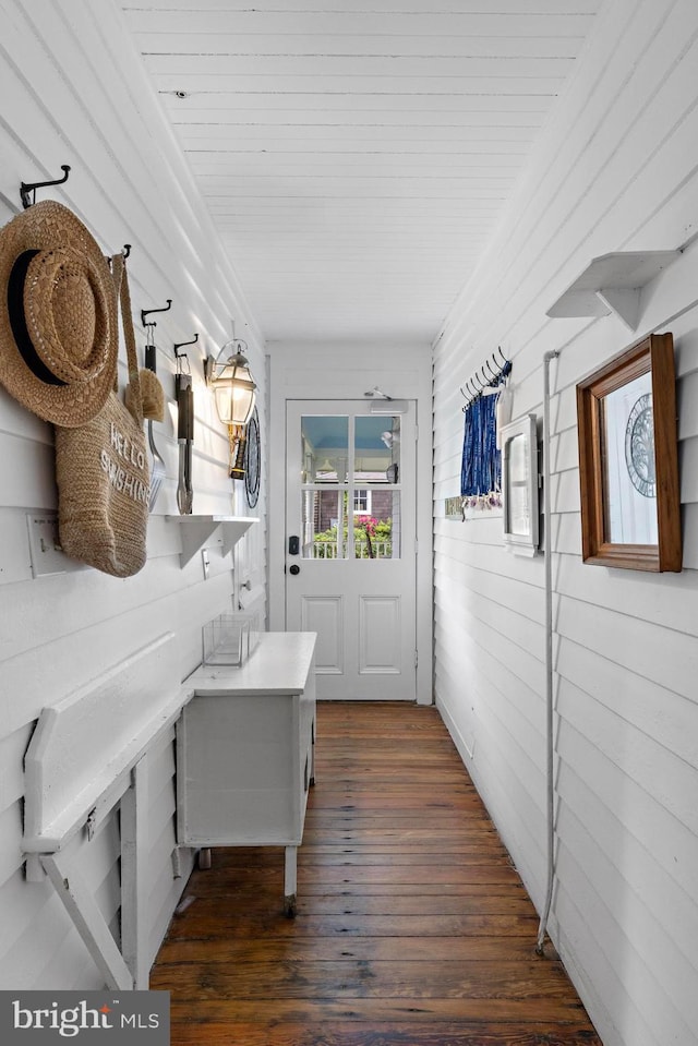 123 Coral St, Beach Haven, NJ 08008 - corridor with dark wood-style floors and wood walls