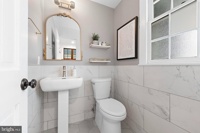 123 Coral St, Beach Haven, NJ 08008 - bathroom featuring toilet, tile walls, wainscoting, and tile patterned floors