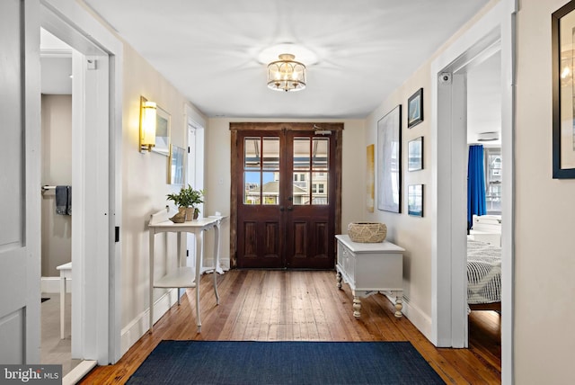 123 Coral St, Beach Haven, NJ 08008 - foyer with hardwood / wood-style floors, baseboards, and a chandelier